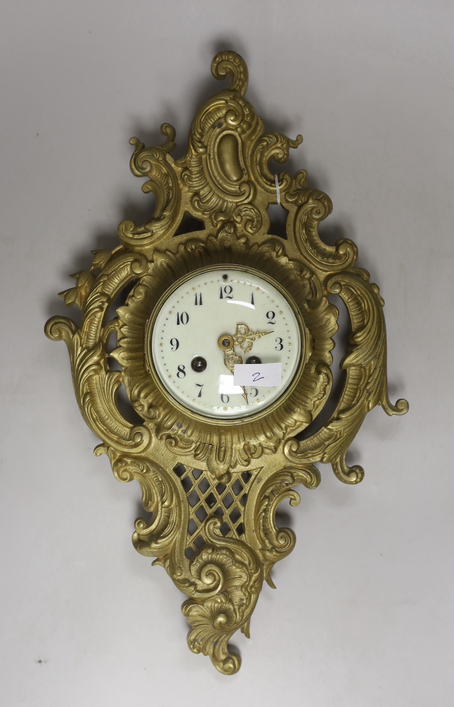 A French brass eight day cartel wall clock, 46cm